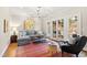 Comfortable living room with ample seating, stylish decor, and natural light from french doors, perfect for gatherings at 2147 Wake Dr, Raleigh, NC 27608