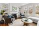Cozy living room featuring a fireplace, built-in shelving, and comfortable seating, ideal for relaxing and entertaining at 2147 Wake Dr, Raleigh, NC 27608