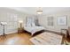 Bright bedroom with hardwood floors, natural light, neutral walls, and stylish decor at 2147 Wake Dr, Raleigh, NC 27608