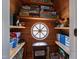 Cozy playroom space with wood paneled walls, shelving, and a unique round window at 2147 Wake Dr, Raleigh, NC 27608