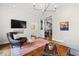 Inviting sitting area features stylish seating, hardwood floors, and decorative lighting at 2147 Wake Dr, Raleigh, NC 27608