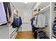 Spacious walk-in closet with custom shelving and hanging rods for organized storage at 2147 Wake Dr, Raleigh, NC 27608