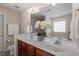 Bright bathroom with double sink vanity, large mirror, and elegant white orchid centerpiece at 4511 All Points View Way, Raleigh, NC 27614