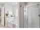 Bright bathroom featuring a soaking tub and glass enclosed shower at 4511 All Points View Way, Raleigh, NC 27614