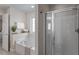 Well-lit bathroom featuring a soaking tub, glass-enclosed shower, and neutral tones at 4511 All Points View Way, Raleigh, NC 27614