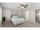 Comfortable bedroom with ceiling fan, carpet floors, and a large window at 4511 All Points View Way, Raleigh, NC 27614