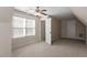 Spacious bedroom with ceiling fan, dormer windows, and carpet flooring at 4511 All Points View Way, Raleigh, NC 27614