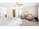 Bedroom featuring a large bed, sitting area and ample natural light at 4511 All Points View Way, Raleigh, NC 27614