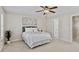 Cozy bedroom with neutral tones, a ceiling fan, and plush carpet at 4511 All Points View Way, Raleigh, NC 27614