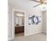 Bedroom showing ensuite bathroom, neutral carpet, ceiling fan and art at 4511 All Points View Way, Raleigh, NC 27614