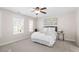 Bright bedroom with large windows, neutral walls, and a ceiling fan at 4511 All Points View Way, Raleigh, NC 27614