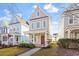 Beautiful two-story house with a cozy front porch and a neatly landscaped yard at 4511 All Points View Way, Raleigh, NC 27614