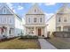 Charming two-story home with a welcoming front porch, landscaped yard, and gray siding at 4511 All Points View Way, Raleigh, NC 27614