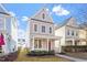 Charming two-story home with a welcoming front porch, landscaped yard, and gray siding at 4511 All Points View Way, Raleigh, NC 27614