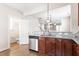 Open-concept kitchen with stainless steel appliances and a view into other living spaces at 4511 All Points View Way, Raleigh, NC 27614