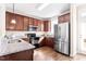 Modern kitchen featuring stainless steel refrigerator and granite countertops at 4511 All Points View Way, Raleigh, NC 27614