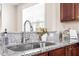Close-up of the kitchen sink with a stylish faucet and granite countertop at 4511 All Points View Way, Raleigh, NC 27614