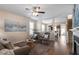 Comfortable living area with hardwood floors, a ceiling fan, and an open layout at 4511 All Points View Way, Raleigh, NC 27614