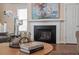 Elegant fireplace in the living room with decorative elements and a stylish design at 4511 All Points View Way, Raleigh, NC 27614