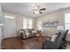 Cozy living room featuring hardwood floors, ample seating, and abundant natural light at 4511 All Points View Way, Raleigh, NC 27614
