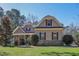 Charming home featuring stone accents, a manicured lawn and mature trees in a desirable neighborhood at 5105 Watkinsdale Ave, Raleigh, NC 27613