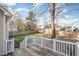 View from a wood deck overlooking a grassy backyard with a wood fence at 5302 Silkwood Dr, Durham, NC 27713