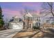 Charming two-story home with a manicured lawn, attached garage, and traditional architectural details at 5302 Silkwood Dr, Durham, NC 27713