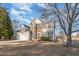 Charming two-story home with a manicured lawn, attached garage, and traditional architectural details at 5302 Silkwood Dr, Durham, NC 27713