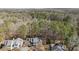 An aerial view showcases this home's private location backed up to a beautiful wooded area with mature trees at 577 Woodbury, Pittsboro, NC 27312