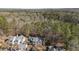 Aerial view showcasing the beautiful homes situated within a lush, wooded community at 577 Woodbury, Pittsboro, NC 27312