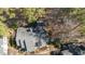 An aerial perspective shows the location among dense mature trees at 577 Woodbury, Pittsboro, NC 27312