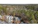 An aerial view showcases this home's location with many surrounding trees and on-site parking at 577 Woodbury, Pittsboro, NC 27312
