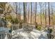 Beautiful deck with table and chairs, perfect for enjoying the wooded scenery at 577 Woodbury, Pittsboro, NC 27312