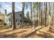 Spacious backyard featuring a private deck, mature trees, and plenty of room to relax at 577 Woodbury, Pittsboro, NC 27312