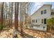 Backyard showing a deck ideal for entertaining and a natural landscape with mature trees at 577 Woodbury, Pittsboro, NC 27312