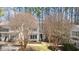 Two-story home with a well-maintained lawn and mature trees offering great curb appeal at 577 Woodbury, Pittsboro, NC 27312