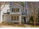 Charming two-story home featuring neutral siding, black shutters, and a welcoming front porch at 577 Woodbury, Pittsboro, NC 27312