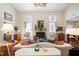 Bright living room with a fireplace and stylish decor at 577 Woodbury, Pittsboro, NC 27312