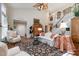 Elegant living room with an open layout, a staircase, and tasteful furnishings at 577 Woodbury, Pittsboro, NC 27312
