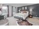Comfortable main bedroom featuring a plush bed, neutral colors, and plenty of natural light at 5921 Sodium St, Raleigh, NC 27610