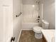 Bathroom featuring a shower and bathtub combo with tile flooring and essential fixtures at 6025 Herston Rd, Raleigh, NC 27610