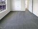 This bedroom offers carpeted floors, closet and a large window creating an inviting space at 6025 Herston Rd, Raleigh, NC 27610