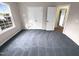 Neutral bedroom features plush carpet, natural light from a window, and closet for ample storage at 6025 Herston Rd, Raleigh, NC 27610