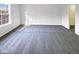 A bright bedroom filled with natural light from a large window at 6025 Herston Rd, Raleigh, NC 27610