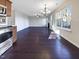 This open-concept living room features hardwood floors and an adjacent kitchen at 6025 Herston Rd, Raleigh, NC 27610