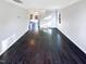Spacious living room featuring dark hardwood floors, ample natural light and neutral walls at 6025 Herston Rd, Raleigh, NC 27610