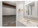 Charming bathroom offering a vanity and view into an ample walk-in closet at 621 Bashford Rd, Raleigh, NC 27606