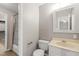 Well-lit bathroom featuring a bathtub with shower and vanity at 621 Bashford Rd, Raleigh, NC 27606
