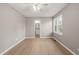 Neutral-toned bedroom offering an en suite bathroom and a sunny window at 621 Bashford Rd, Raleigh, NC 27606