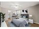 Comfortable bedroom with a ceiling fan, a desk, a rug and a nice view from the large window at 621 Bashford Rd, Raleigh, NC 27606